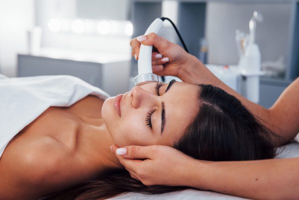 Close up view of woman that lying down in spa salon and have face cleaning procedure at a medical spa in Vancouver